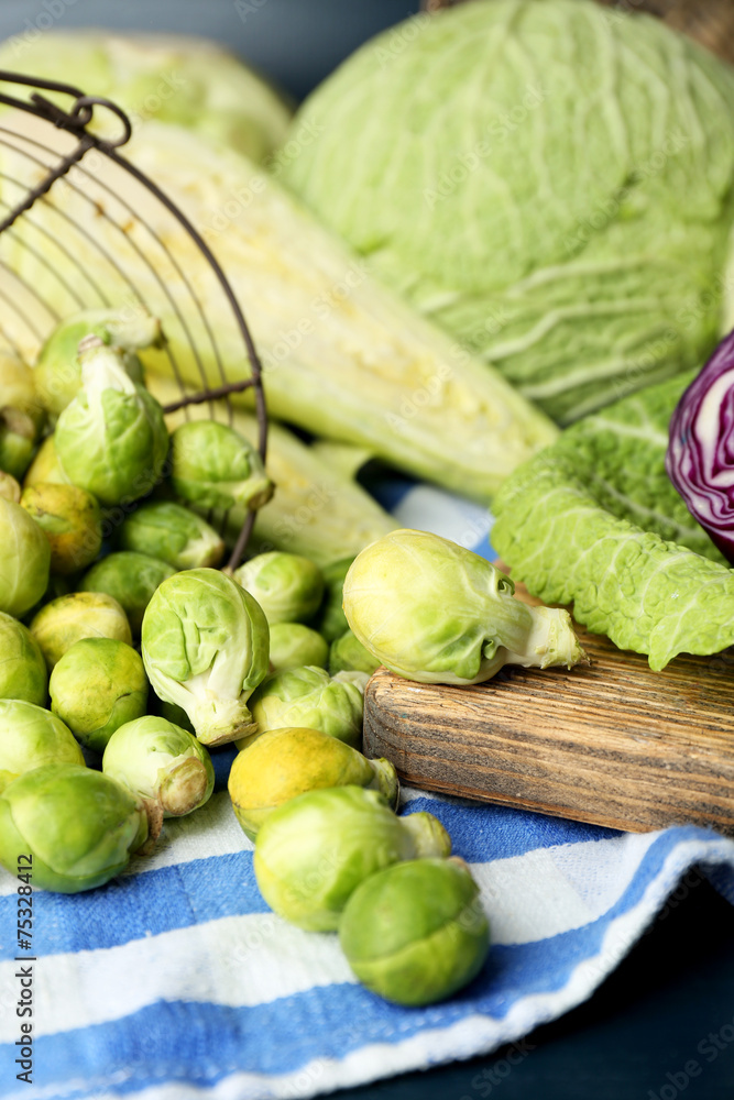 Still life with assortment cabbages on wooden background