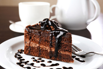 Canvas Print - Yummy chocolate cake served on table, close-up