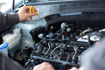 Mechanics at repair shop. two mechanics working on a car engine