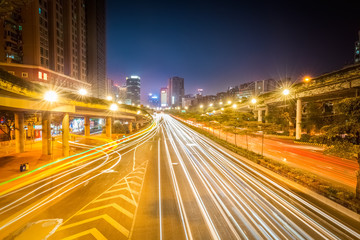 Poster - light trails on city road at night