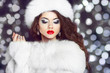 © Victoria Andreas - Fashion girl model posing in fur coat and white furry hat. Winte