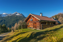 Old Wooden Hut Cabin In Mountain Alps At Rural Fall Landscape