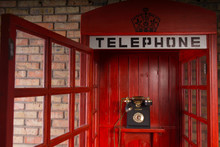 Red Public Telephone Booth With Open Door