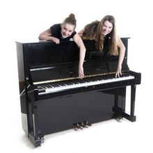 Two Teenage Girls And Black Upright Piano