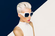 © Porechenskaya - Blonde model in trendy sunglasses with stylish Haircut. Fashion