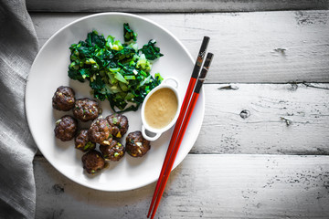 Wall Mural - Meatballs with green salad and honey mustard sauce