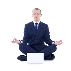 Wall Mural - young business man sitting in yoga pose with laptop isolated on