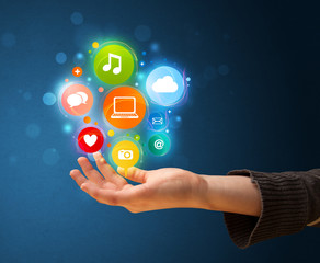 Fototapete - Multimedia icons in the hand of a woman