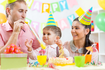 parents have fun time celebrating birthday of kid son