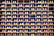 Collection Of Bowling Shoes In Their Rack Background
