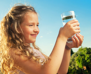 Poster - Girl holding glass with water