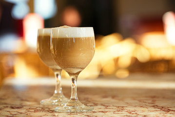 spanish coffee latte in tall glasses with morning sunny backgrou