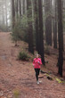 © Maridav - Woman running in forest woods training
