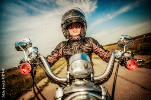 Fototapeta do kuchni Biker girl on a motorcycle