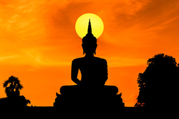 silhouette big buddha statue sitting on sunset