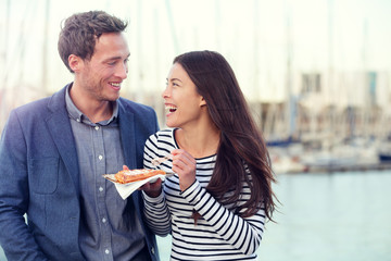 Dating couple tourists eating waffles on date