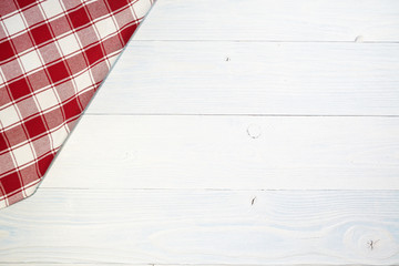 red folded tablecloth over old wooden table