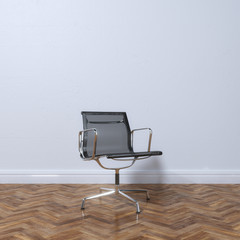 Poster - New stylish office armchair on parquet flooring - front view