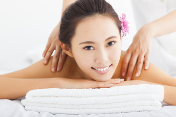 Wall Mural - young woman in spa salon getting massage