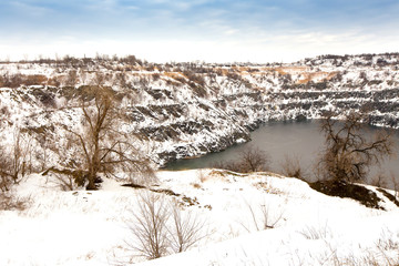 flooded granite quarry in winter