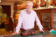 © Monkey Business - Portrait Of Violin Maker In Shop