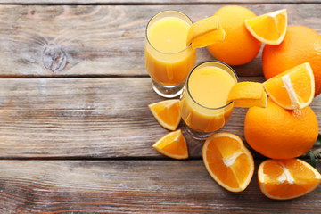 Wall Mural - Freshly squeezed orange juice on wooden table