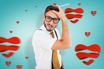 Leinwandbilder - Composite image of geeky hipster scratching his head