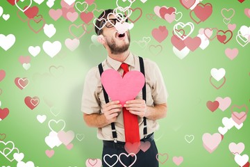 Leinwandbilder - Composite image of geeky hipster crying and holding heart card