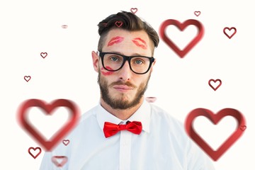 Poster - Composite image of geeky hipster with kisses on his face