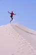 © fresnel6 - Young on top of a dune,jumping on the sand
