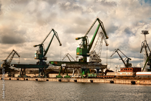 Cranes at the Gdynia harbor. Cloudy day. Poland.