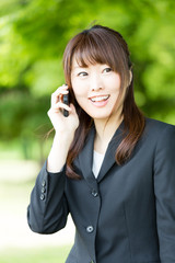 Wall Mural - asian businesswoman in the park