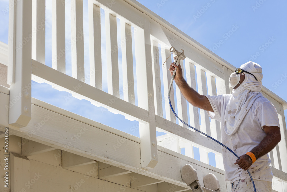 House Painter Spray Painting A Deck of A Home - obrazy, fototapety, plakaty 