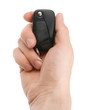 Hand holding car keys isolated on white background