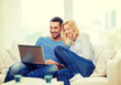 © Syda Productions - smiling happy couple with laptop at home