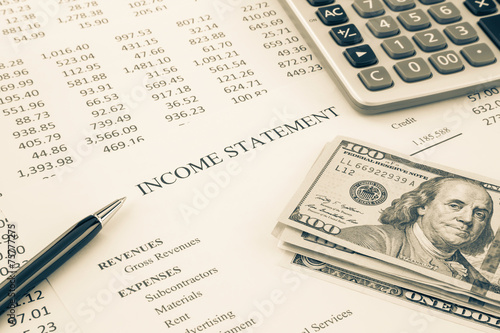 Fotografía Money and income statement report in sepia tone