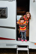© Iuliia Sokolovska - Kids in camper (rv), family travel in motorhome on vacation