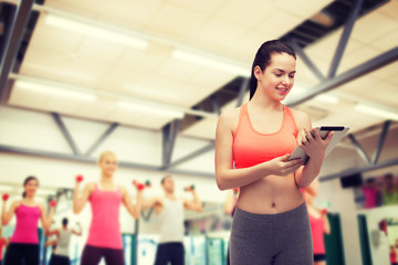 Canvas Print - sporty woman with tablet pc computer