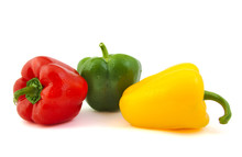 Close Up Of Green, Red And Yellow Fresh Peppers On White