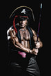 © kanzefar - Muscular man in a pirate costume.