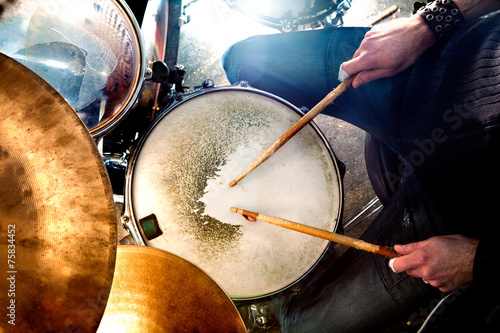 Cuadros en Lienzo Man playing the drum.Live music background concept.Drummer