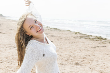 Wall Mural - Young woman happy on beach