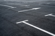 Asphalt surface of the parking with road marking lines