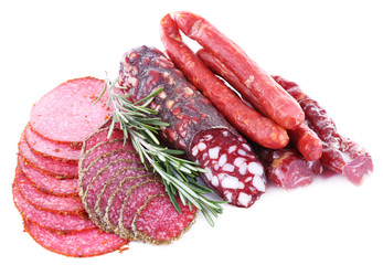 Wall Mural - Assortment of smoked sausages isolated on white
