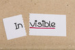 Sign with word invisible turned into visible