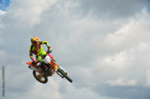 Fototapeta na szkło MX jeździec na motocyklu w powietrzu