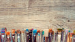 © chamillew - Row of artist paintbrushes closeup on old wooden rustic backgrou