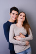 © W PRODUCTION - close up studio portrait of a beautiful young couple man woman