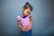 © maxximmm - Teen girl child abdominal pain on gray background