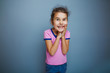 © maxximmm - the girl child is happy surprise on gray background